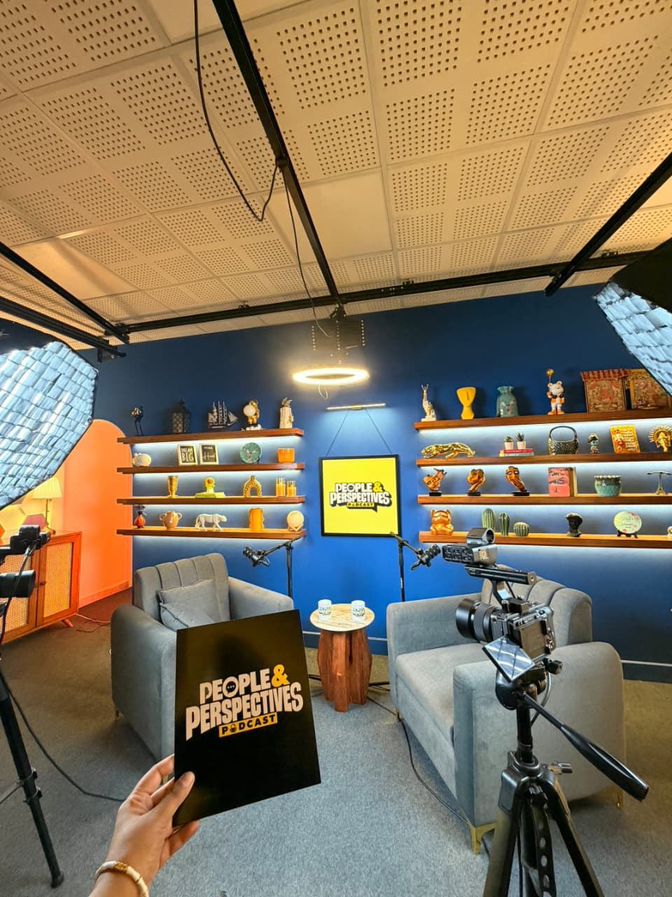 Wide shot of the studio with cameras and lights
